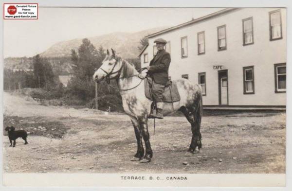  Man on horse, in front of Philbert Hotel