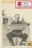 Unknown Man hold Associated Sign